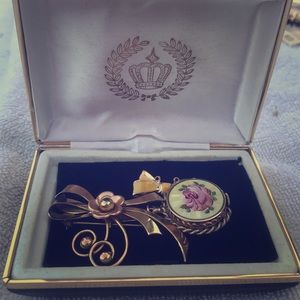 Gold brooch and pocket watch attached